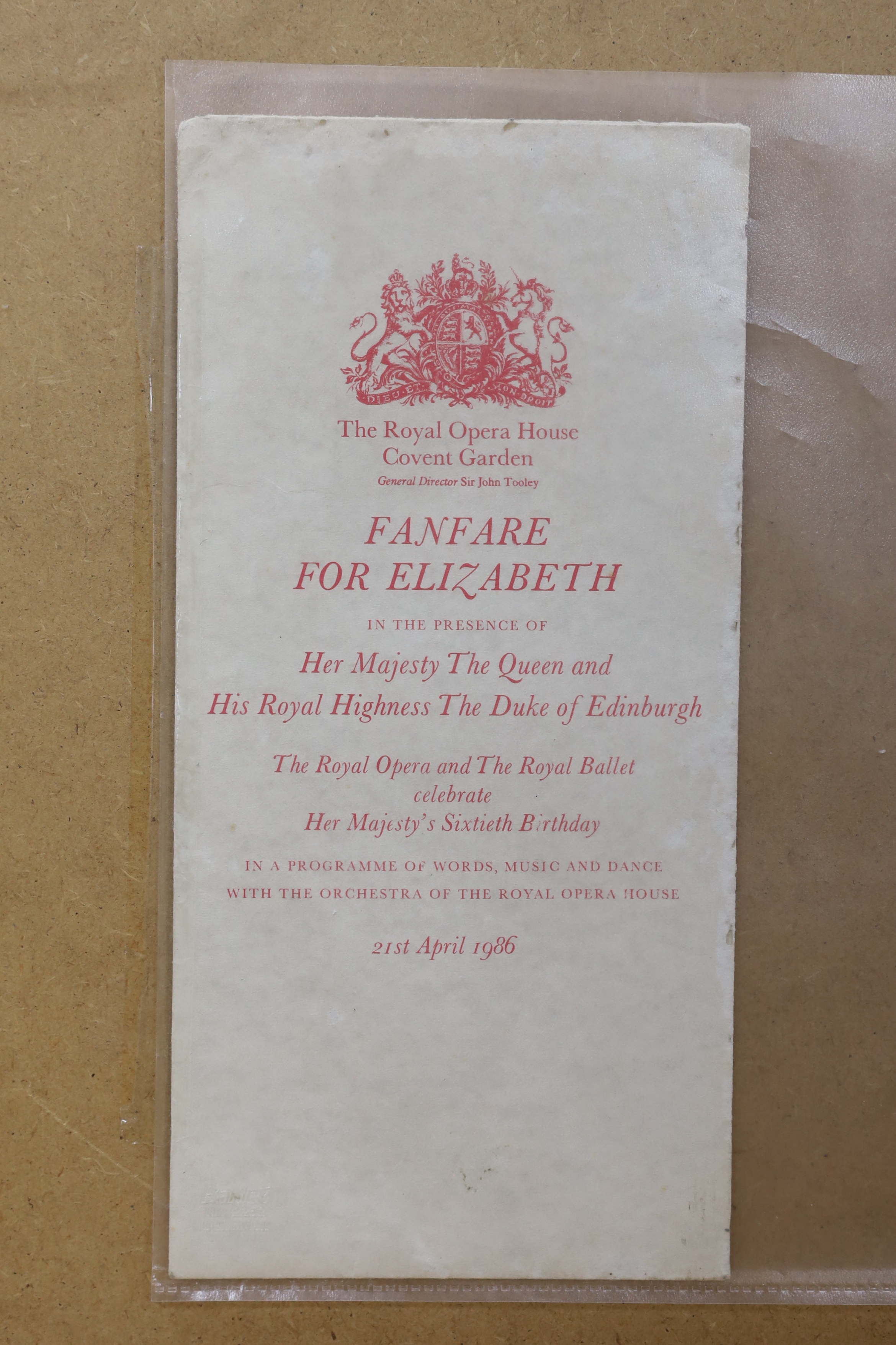 A vintage silk Royal Opera Covent Garden programme, Fanfare for Elizabeth II, 21st April, 1986, designed by Michael Szell, original envelope verso, 57 x 37cm